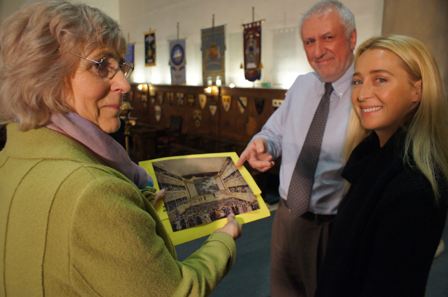 Malcolm Toogood shows Asher Keddie the picture guides use to show the interior of the theatre